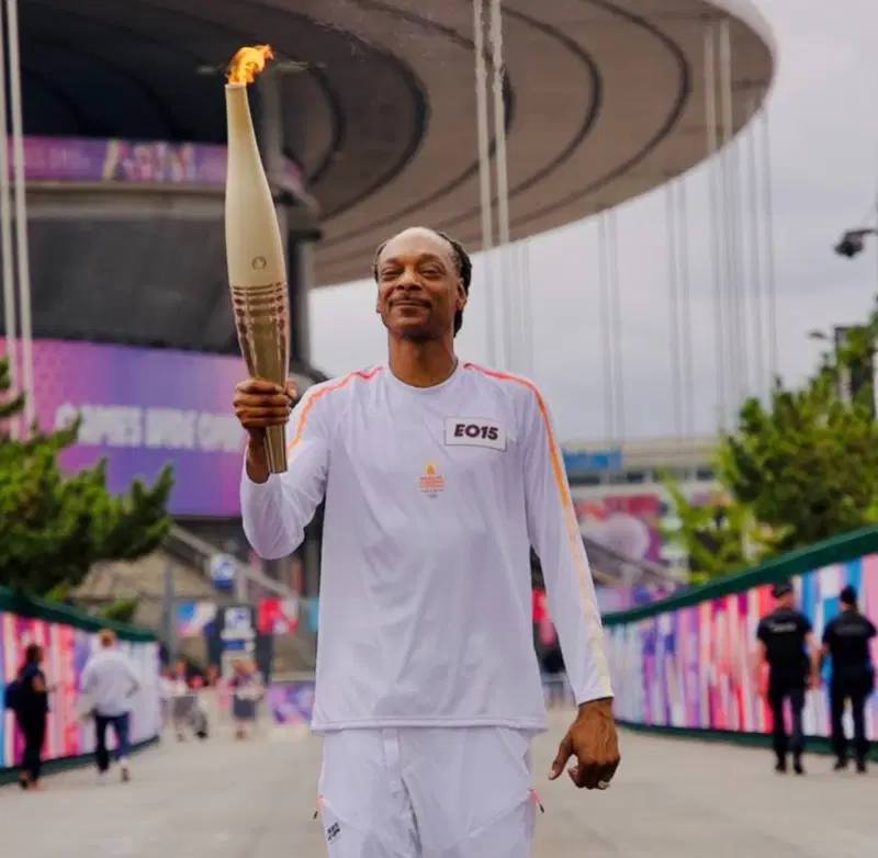 US Rapper Snoop Dogg Stars as Olympic Flame Sails into Paris